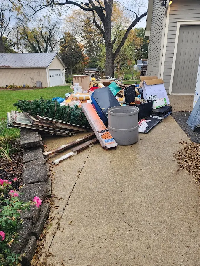 Dumpster being loaded with debris for Roofing Dumpster Rental in Chestnuthill